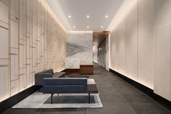 a lobby with couches at The Paxton, Brooklyn, NY